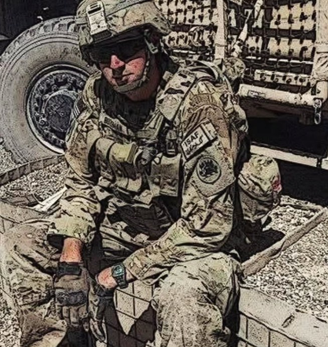 Juice in military uniform, seated beside a vehicle