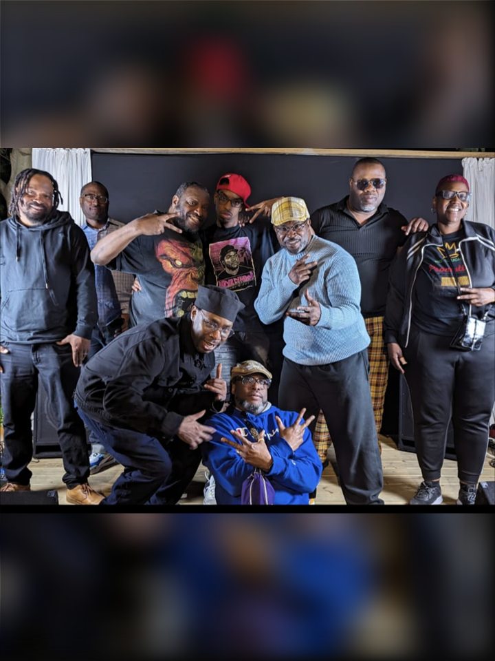 A group of artists and friends pose together, 2024.
