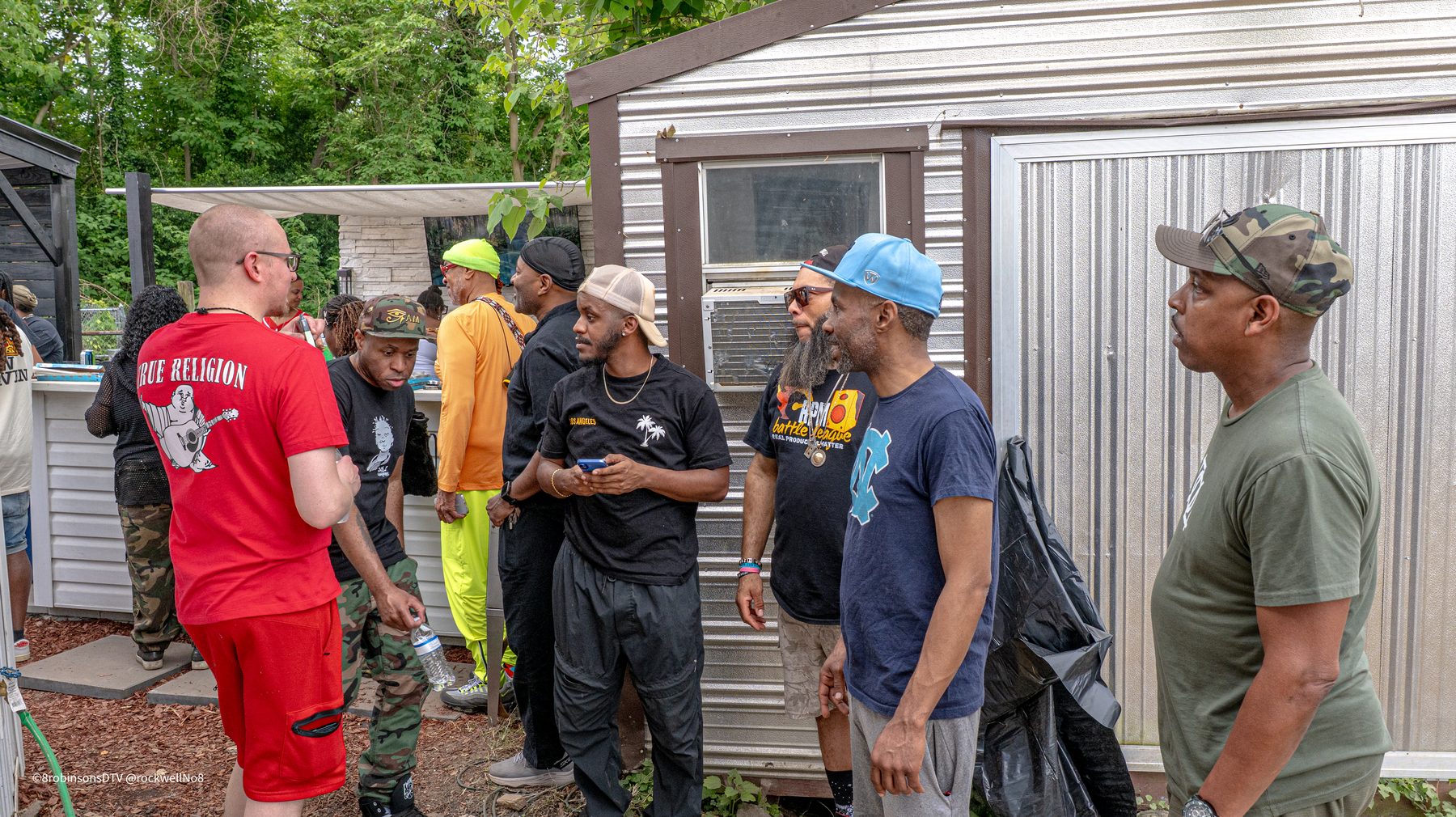 Guests gathering at the outdoor kitchen